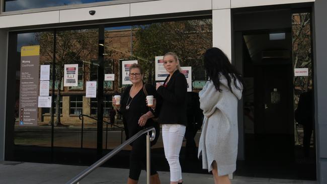 Tahlia O'Grady (white pants), 21, of Wyee, leaves Wyong Local Court after being sentenced to a 20-month Intensive Corrections Order. Picture: Richard Noone