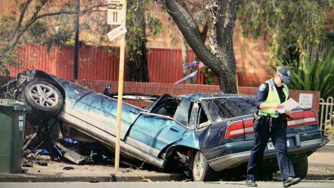 Police at the scene of the crash on Torrens Rd, which killed a man. Picture: Tait Schmaal