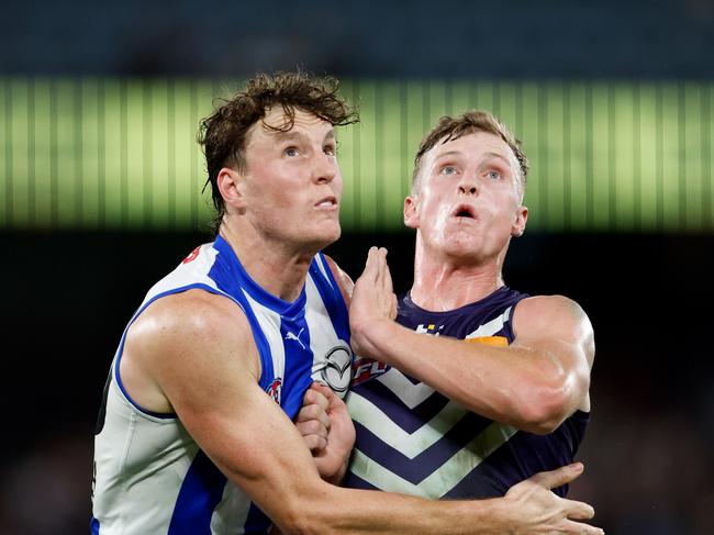 Nick Larkey of the Kangaroos and Josh Treacy of the Dockers compete in a ruck contest. Picture: Dylan Burns/AFL Photos via Getty Images.