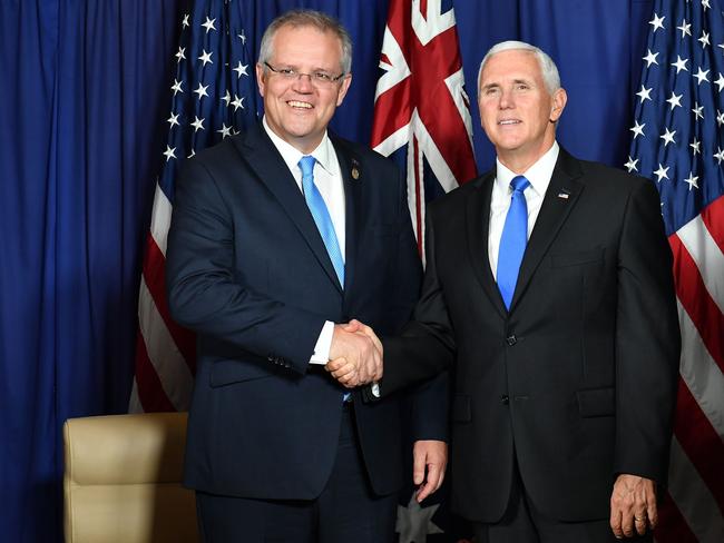 US Vice President Mike Pence (R) shakes hands with Australia's Prime Minister Scott Morrison during a meeting in Port Moresby on November 17, 2018, ahead of the Asia-Pacific Economic Cooperation (APEC) Summit. (Photo by SAEED KHAN / AFP)