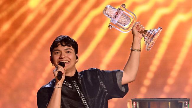 Austrian singer Johannes Pietsch celebrates with the 2025 Eurovision Song Contest trophy after winning the grand final in Basel. Picture: Fabrice Coffrini / AFP