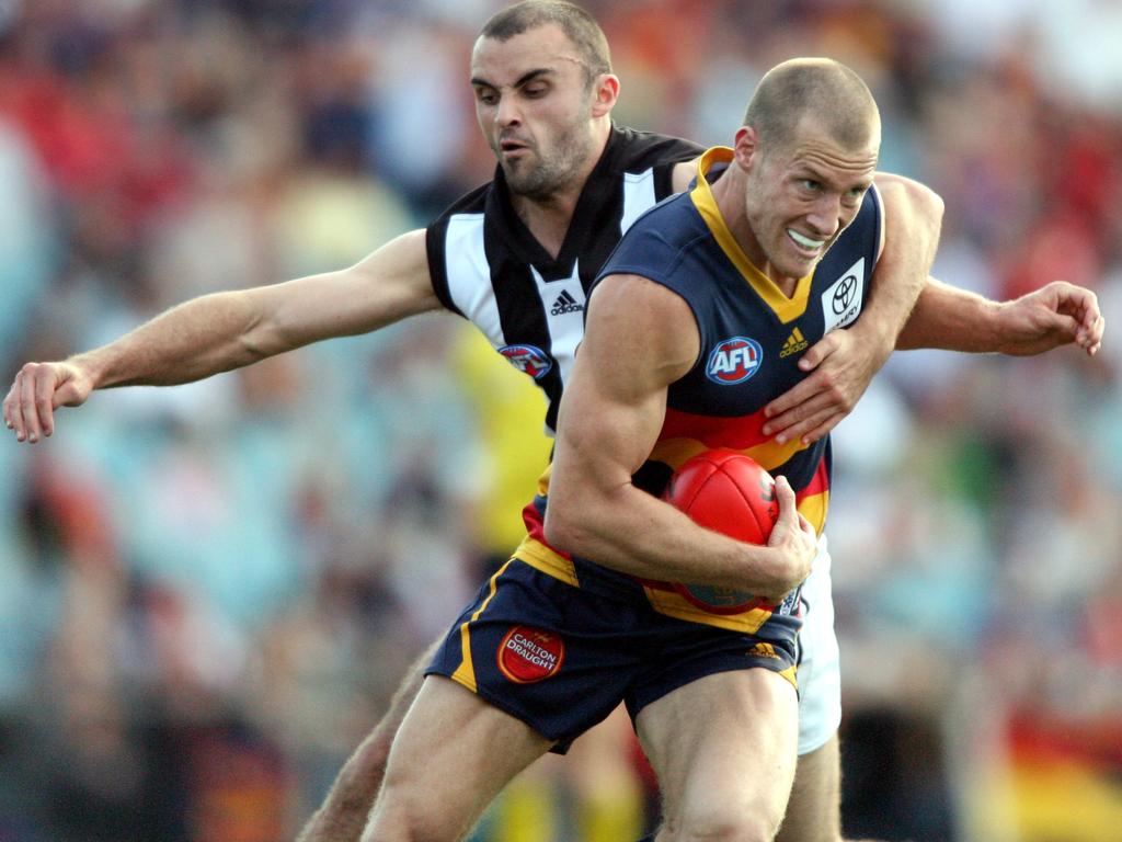 2008 - Scott Thompson takes on Collingwoody’s Rhyce Shaw during the elimination final match at AAMI Stadium.