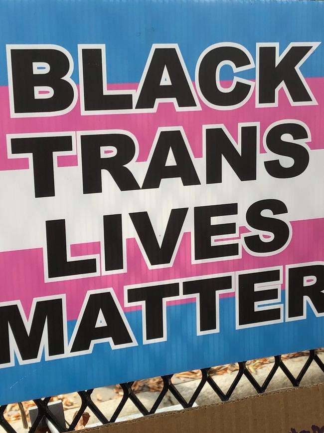 A "Black Trans Lives Matter" placard is posted on a fence near the White House in Washington. Picture: Chris Kenny