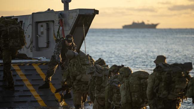 Troops boarding a landing craft during an exercise.