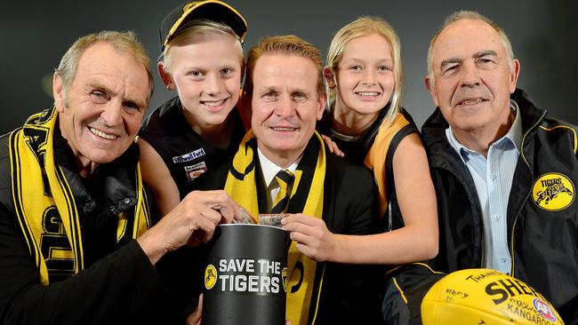 Glenelg Football Club legend Graham Cornes, fan Joe Chigwidden, 11, club president Nick Chigwidden, fan Summer Ryan, 12, and club legend Peter Carey at the launch of the Save the Tigers fund. Picture: Bianca De Marchi