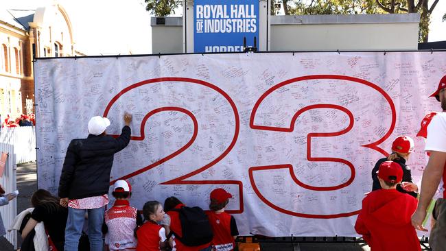 Fans left messages on a mural for Lance Franklin at Swans HQ. Photo by Phil Hillyard