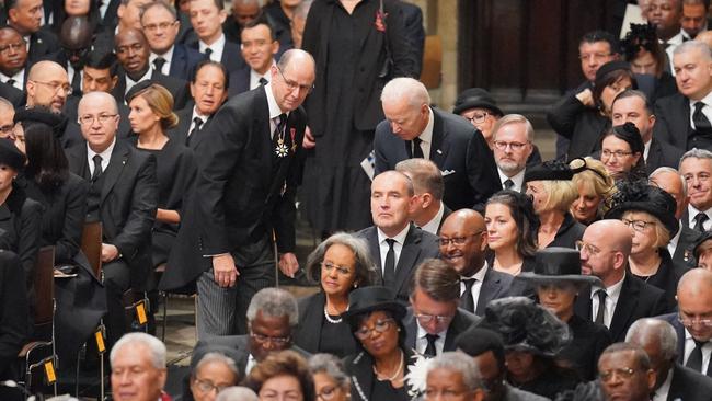 US President Joe Biden takes his seats with other heads of state and dignitaries. Picture: Getty Images