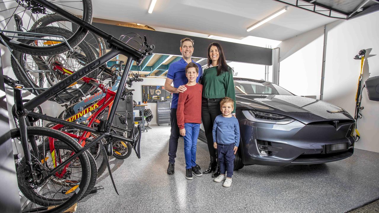 Electric car or bicycle? This is the choice Clinton and Rosie Waters with sons Harvey, 10, and Hugo, four, have to make. Picture: Tim Carrafa