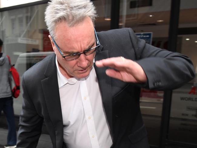 ATO deputy commissioner Michael Cranston, the father of Adam Cranston, is seen near the Central Local Court in Sydney on Thursday, May 18, 2017. Adam Cranston is one of nine people have been arrested over a $165 million tax fraud investigation. (AAP Image/Paul Miller) NO ARCHIVING