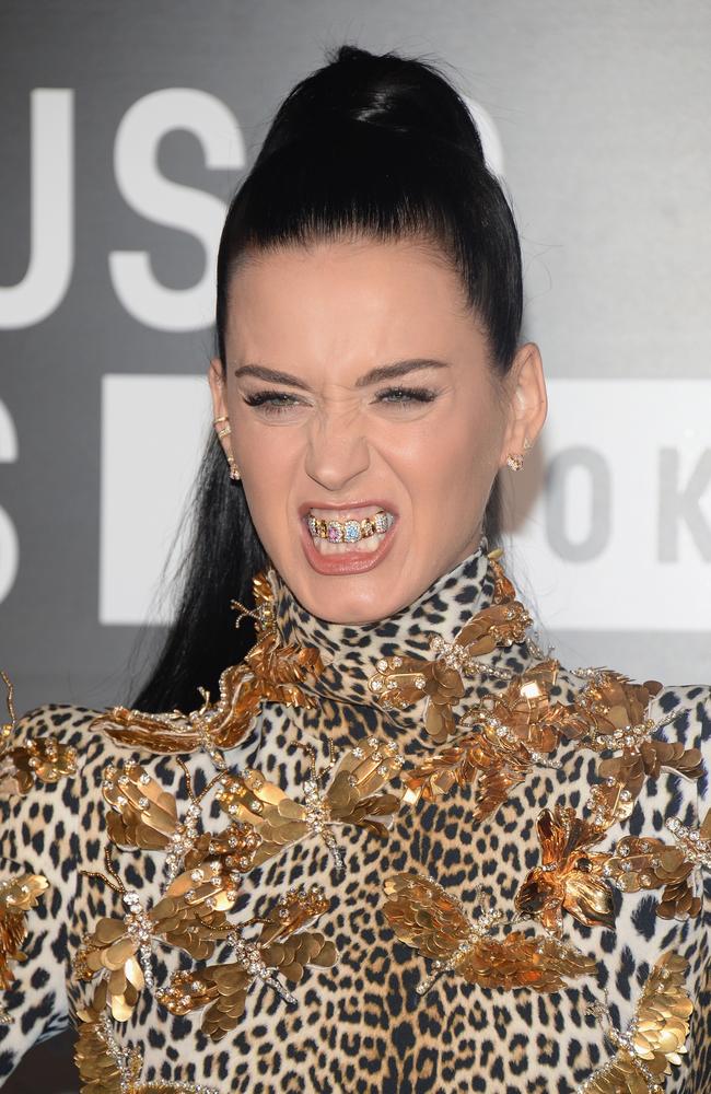 2013: Perry wore blingy grills during her ‘Roar’ single era. Picture: Jamie McCarthy/Getty Images for MTV