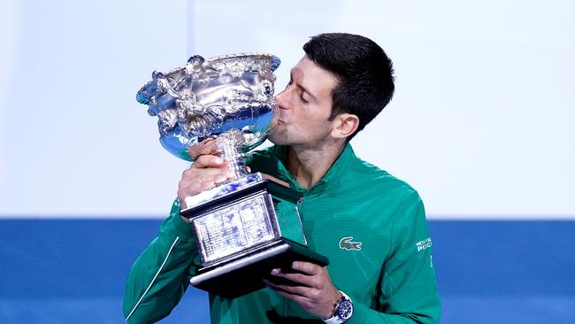 Novak Djokovic of Serbia poses for a photograph with the Norman Brookes Challenge Cup after winning the men's singles final on day 14 of the Australian Open tennis tournament at Rod Laver Arena in Melbourne, Sunday, February 2, 2020. (AAP Image/Michael Dodge) NO ARCHIVING, EDITORIAL USE ONLY