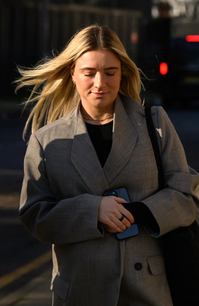 Kristie Mewis cradles her pregnant belly outside court. Picture: Getty Images