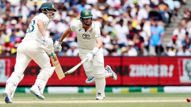 Australia's Pat Cummins and Marnus Labuschagne scramble for a run under intense pressure against India Picture: AFP