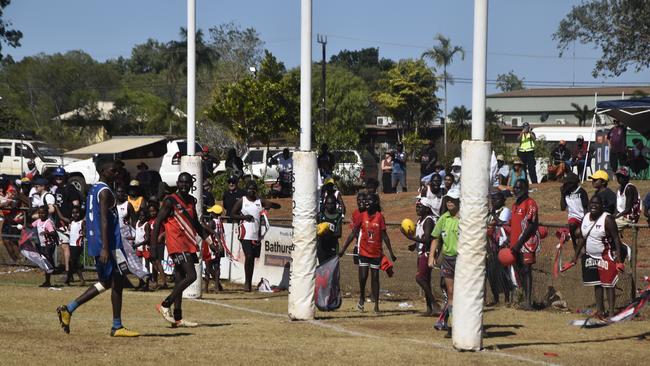 Thunder fans cheering for Adam Tipungwuti’s mark in the Tiwi Island Football League grand final between Tuyu Buffaloes and Pumarali Thunder. Picture: Max Hatzoglou