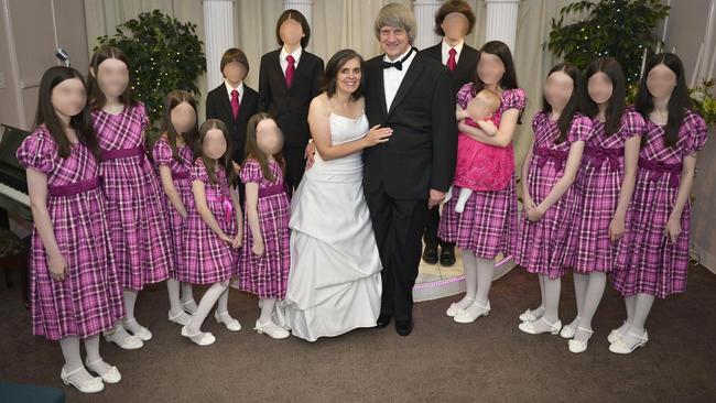 David Turpin, 57, and Louise Turpin, 49, renew their wedding vows with their children looking on.