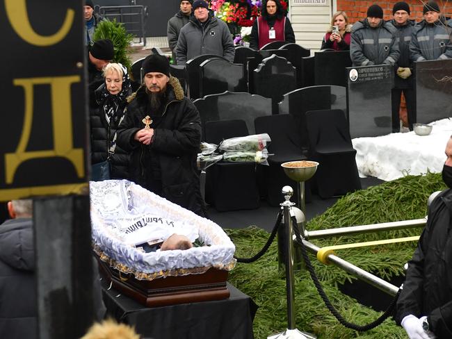 An Orthodox priest mourns next to the body of late Russian opposition leader Alexei Navalny. Picture: AFP