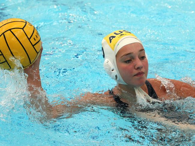 Under 19 Australian Water Polo Championships - Chelsea Isaac of the Youth Barbarians under pressure from Olivia Scamoni of South Australia on Saturday, December 10, 2022 in St Kilda East, Victoria, Australia.