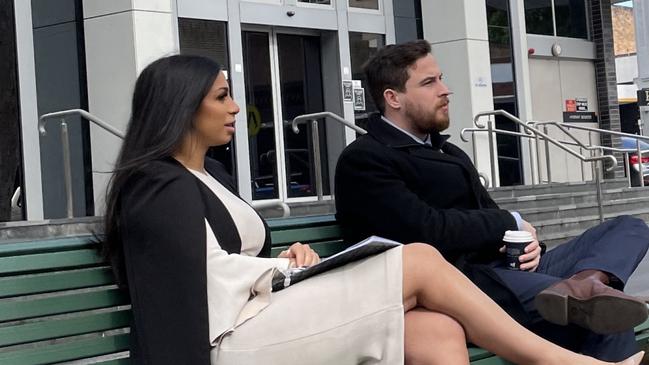 April Julie Kaur Bal (left) sitting outside Bankstown Local Court on July 19, 2022, with lawyer William Martyr. Bal was convicted of mid-range drink driving. Picture: Paul Brescia