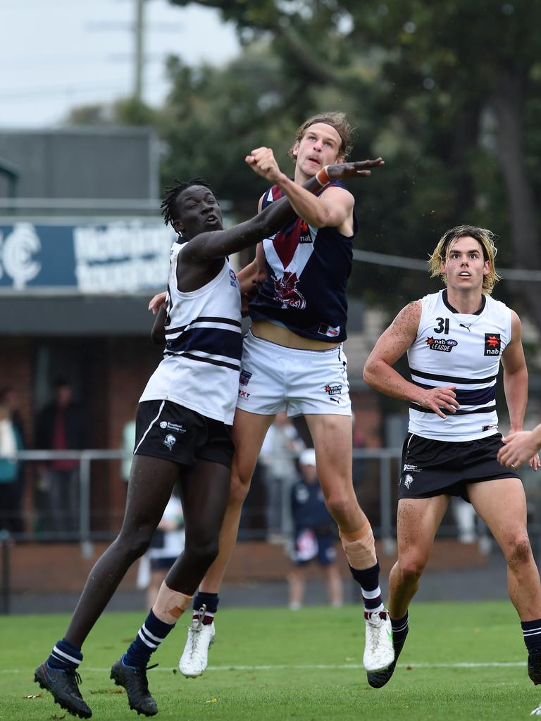 Domanic Akuei and Jacob Edwards contest the ball. Picture: Steve Tanner