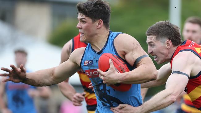 Sturt’s Tom Lewis breaks clear of Adelaide’s Louis Sharrad at Unley Oval in Round 17. Picture: David Mariuz/SANFL