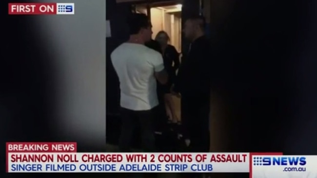 Nine News footage shows Noll being questioned by guards outside the club.