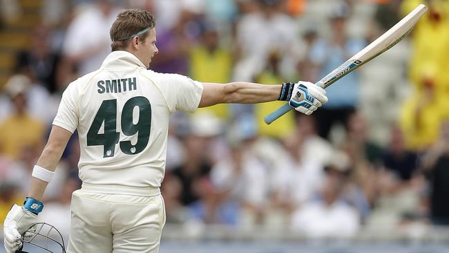 Smith salutes the crowd after reaching triple figures. Picture: Getty Images