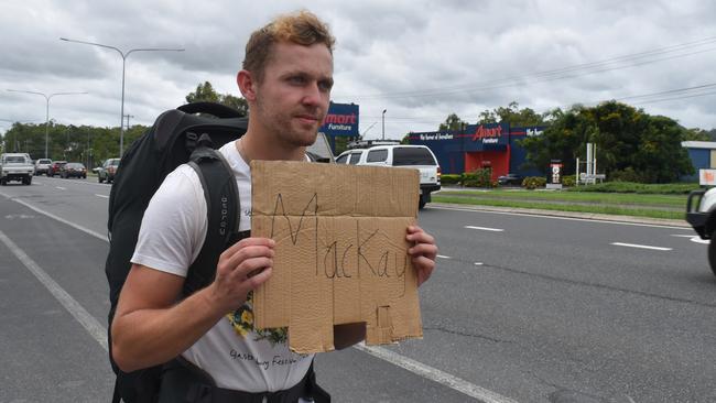 British backpacker Ross Millen is trying everything he can to get to Mackay after his bus heading to Airlie Beach stopped in Rockhampton due to a major rain event in Queensland's north.