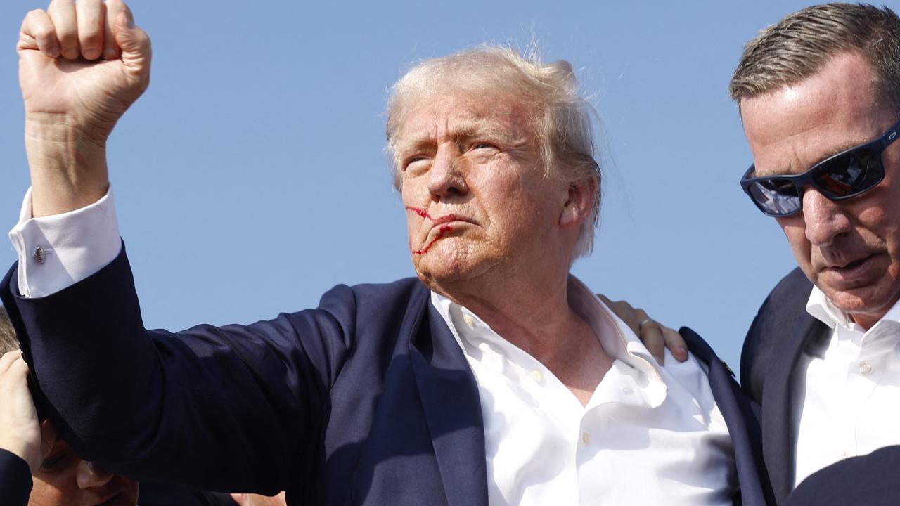 He raised a defiant fist to the crowd. Picture: Anna Moneymaker/Getty Images via AFP