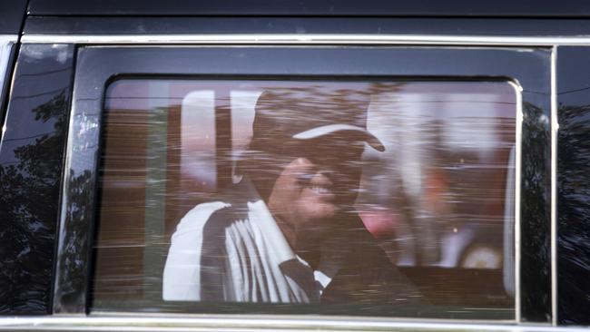 Donald Trump grins as he drives past supporters in West Palm Beach, Florida. Picture: Getty Images.