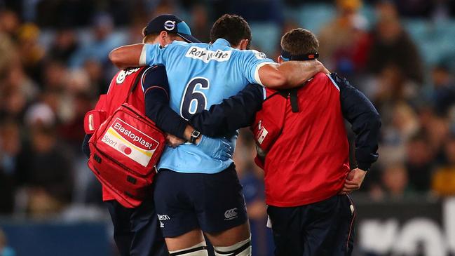 SYDNEY, AUSTRALIA - JUNE 28: Dave Dennis of the Waratahs is taken from the field with an injury during the round 17 Super Rugby match between the Waratahs and the Brumbies at ANZ Stadium on June 28, 2014 in Sydney, Australia. (Photo by Mark Nolan/Getty Images)