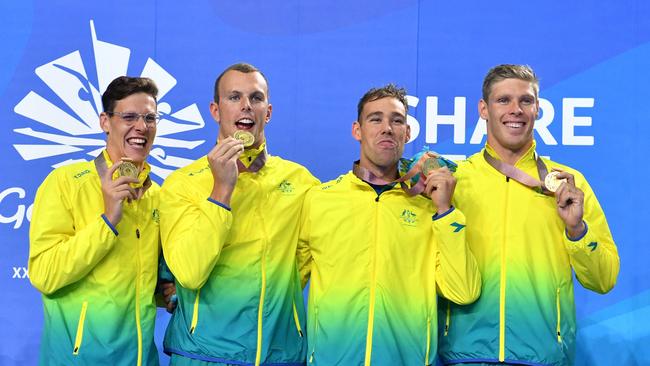 Australian swimmers Mitch Larkin, Kyle Chalmers, Grant Irvine and Jake Packard with their 4x100m medley relay gold medals from the Gold Coast Commonwealth Games. Picture: Darren England / AAP