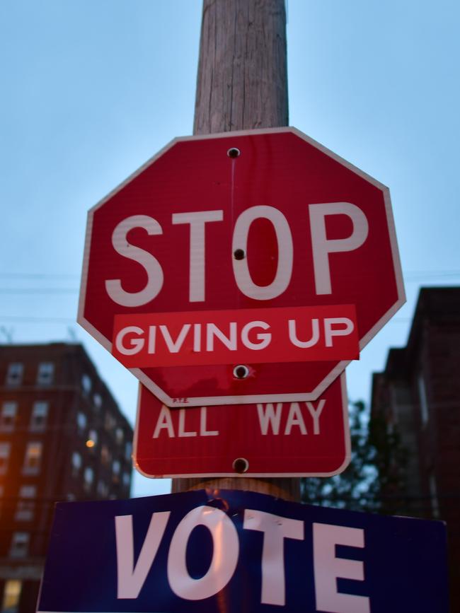 A sticker attached to a Stop sign in Philadelphia encourages everyone to get out and vote Picture: AFP.