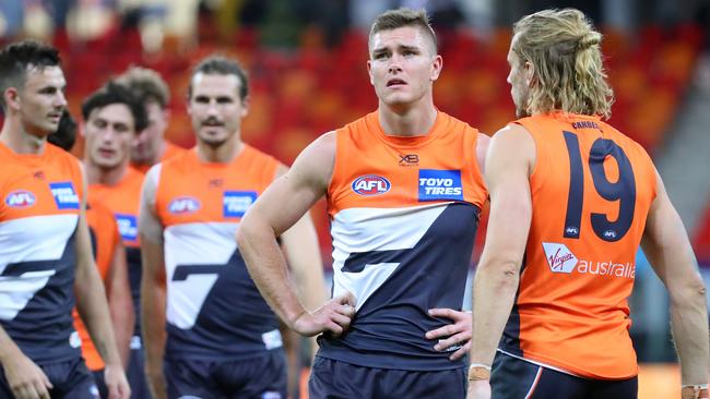 Players from the GWS Giants reacts after losing the Round 22 AFL match between the GWS Giants and Western Bulldogs.