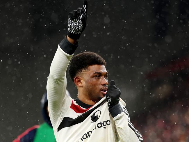 LIVERPOOL, ENGLAND - JANUARY 05: Amad Diallo of Manchester United celebrates scoring his team's second goal during the Premier League match between Liverpool FC and Manchester United FC at Anfield on January 05, 2025 in Liverpool, England. (Photo by Carl Recine/Getty Images)