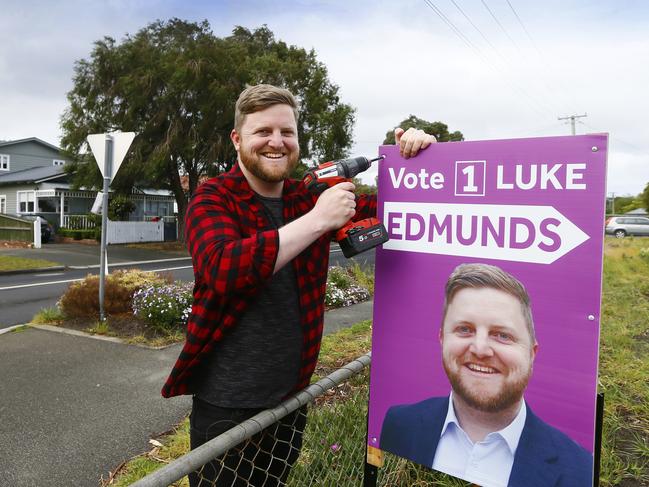 Labor member and Clarence alderman candidate Luke Edmunds puts up an election sign in Bellerive. Picture: MATT THOMPSON