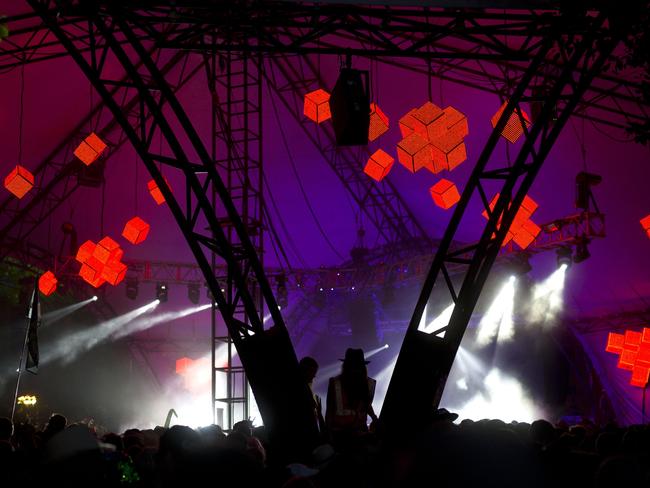 People dancing at ‘The Glade’ on Worthy Farm. Oicture: AFP/OLI SCARFF