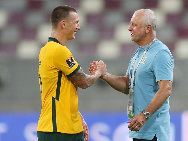 DOHA, QATAR - SEPTEMBER 02: Mitchell Duke celebrates with Graham Arnold, Head Coach of Australia after the 2022 FIFA World Cup Qualifier match between Australia and China PR at Khalifa International Stadium on September 02, 2021 in Doha, Qatar. (Photo by Mohamed Farag/Getty Images)