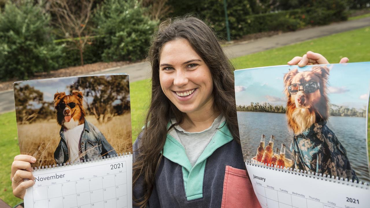 SWEET TRIBUTE: Darby Brown with the 2021 calendar featuring Australian Shepherd Austin. Pictures: Kevin Farmer.