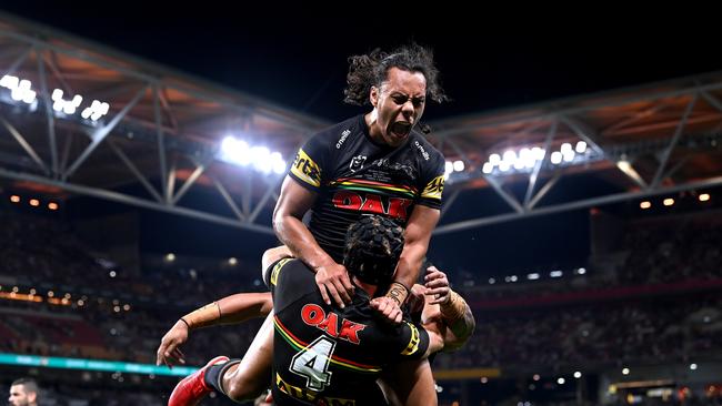 *APAC Sports Pictures of the Week - 2021, October 4* - BRISBANE, AUSTRALIA - OCTOBER 03: Jarome Luai of the Panthers celebrates with Matt Burton of the Panthers after he scored a try during the 2021 NRL Grand Final match between the Penrith Panthers and the South Sydney Rabbitohs at Suncorp Stadium on October 03, 2021, in Brisbane, Australia. (Photo by Bradley Kanaris/Getty Images)