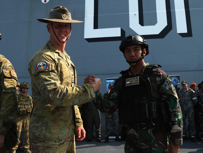 A ceremonial patch sharing ceremony between Australian Defence Force and Indonesian National Armed Forces aboard the HMAS Adelaide in Darwin ahead of Exercise Keris Woomera on November 3. Picture: Zizi Averill