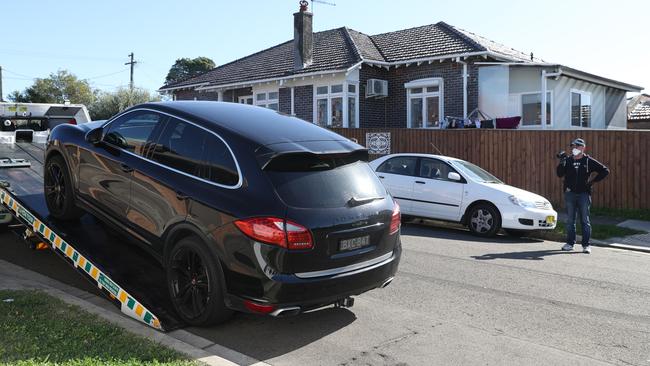 AFP staff seized a Porsche during the raids. Picture: John Grainger