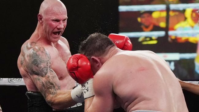 Barry Hall connects with an uppercut. Picture: AAP