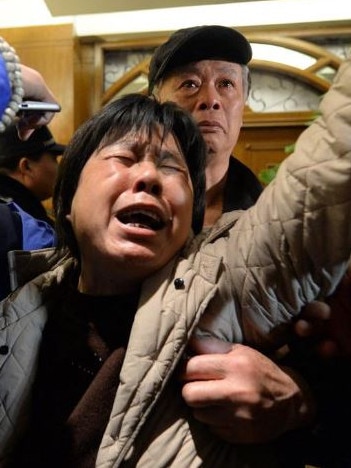 A relative of passengers on Malaysia Airlines flight MH370 cries after hearing the news that the plane plunged into Indian Ocean at a hotel in Beijing on March 24, 2014. Picture: Goh Chai Hin/AFP