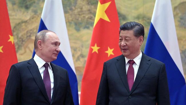 Russian President Vladimir Putin and Chinese President Xi Jinping pose for a photograph during their meeting in Beijing in February. Picture: Alexei Druzhinin / Sputnik / AFP