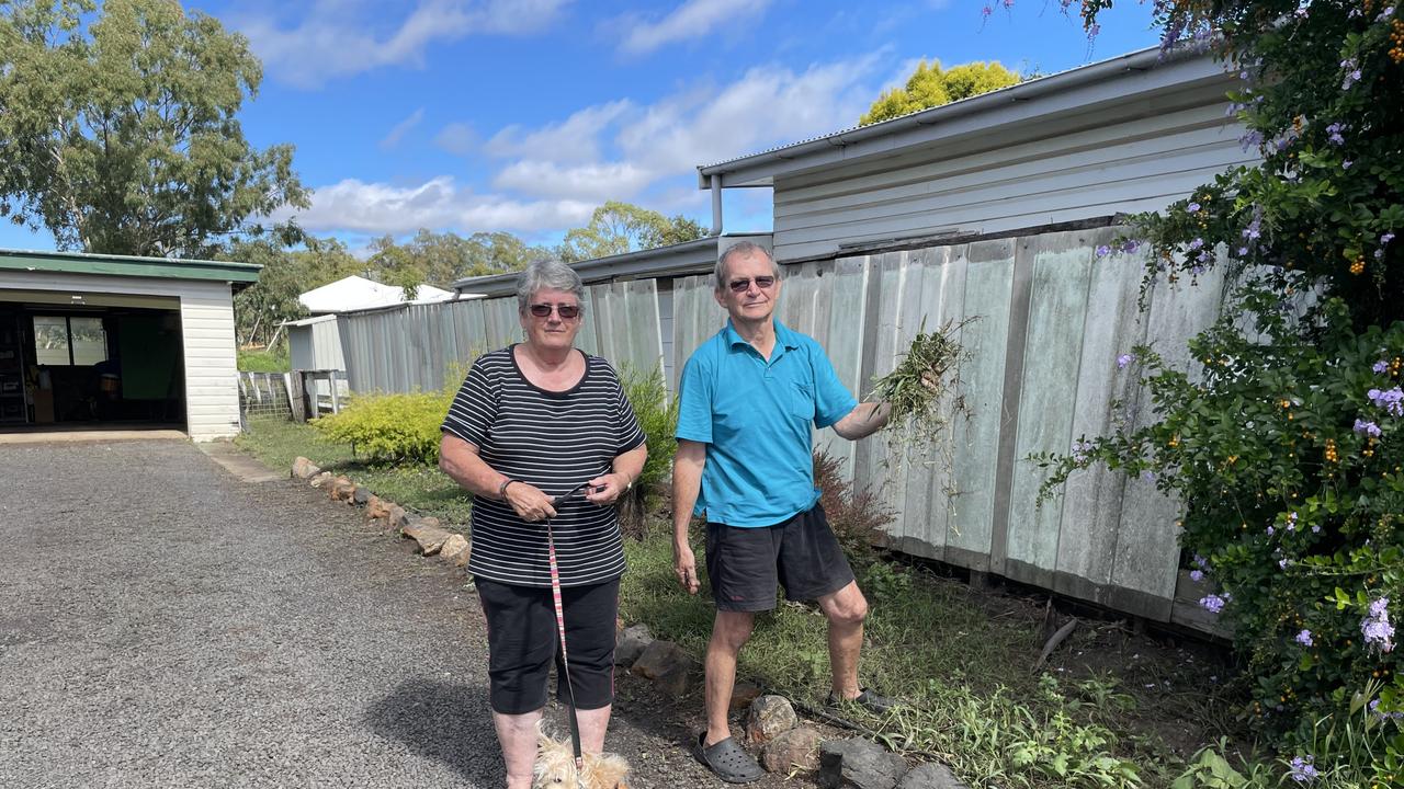 Robyn and Wayne Rose clean up after the Dalby floods, March 2022 Picture: Emily Devon