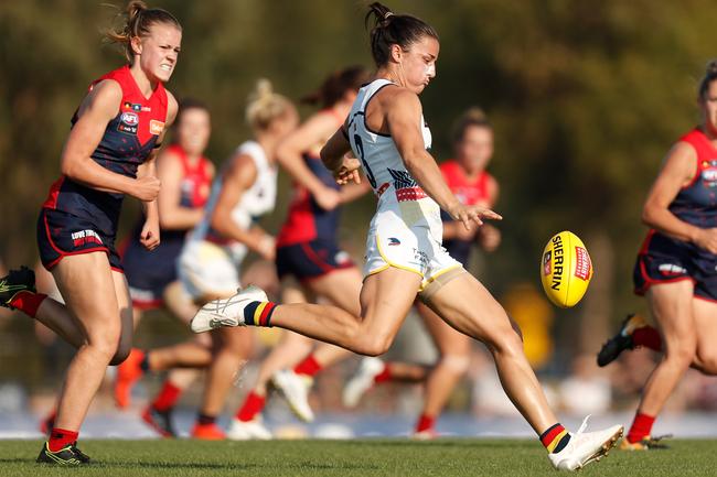 Crows Angela Foley kicks the ball against the Melbourne Demons at Casey Fields in Melbourne,