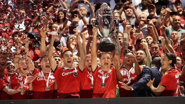 Adelaide United captain Michael Jakobsen lifts the FFA Cup at Hindmarsh Stadium. Picture: Sarah Reed