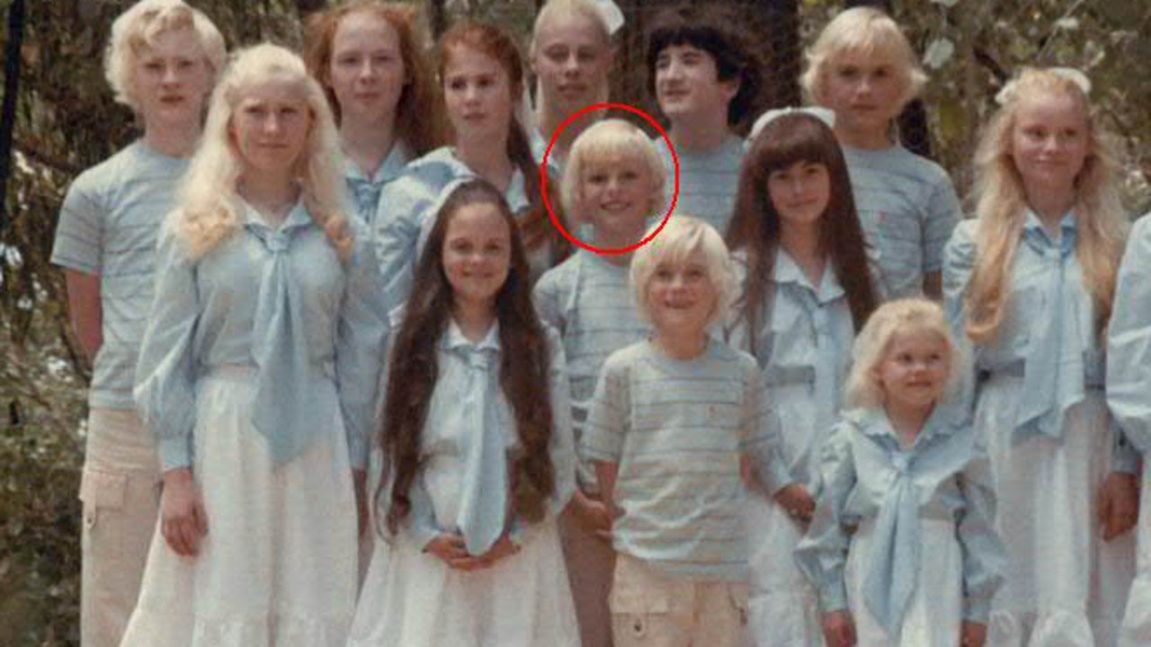 Mr Shenton (circled) as a child, dressed in matching outfits with his brothers and sisters.