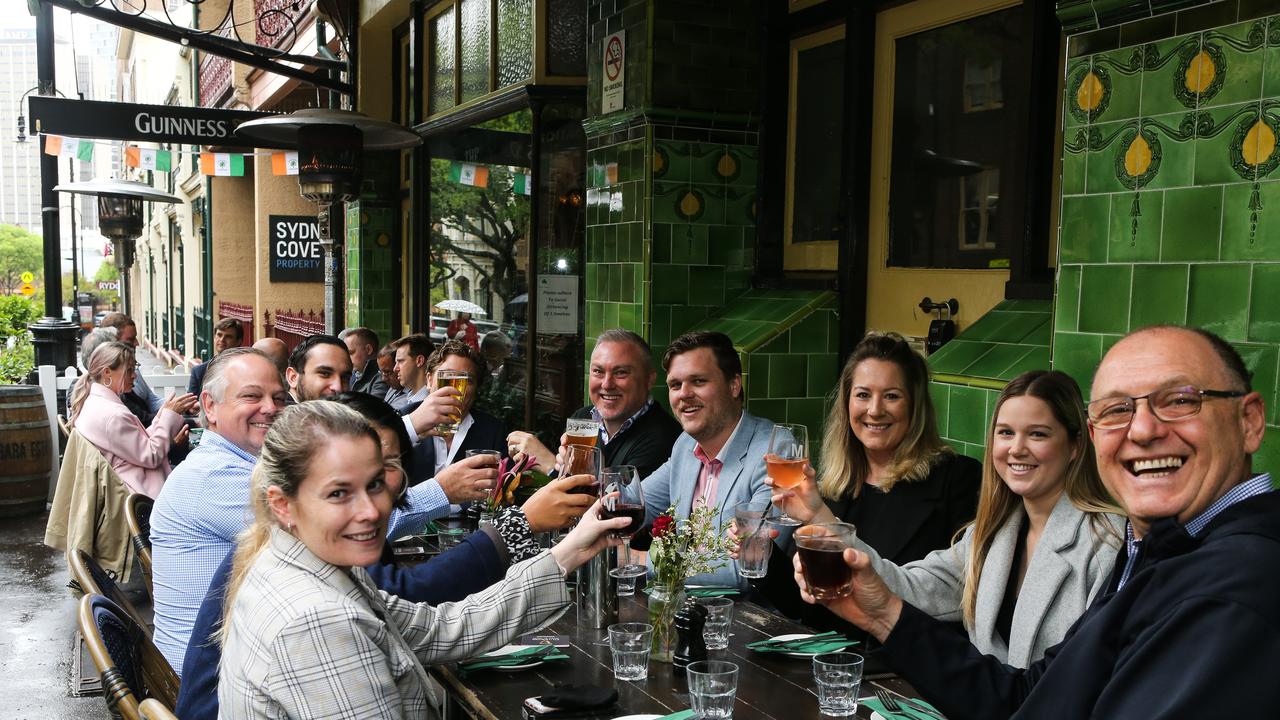 Excited patrons enjoy their first beer back at the Mercantile Hotel in The Rocks. Picture: Gaye Gerard / NCA NewsWire