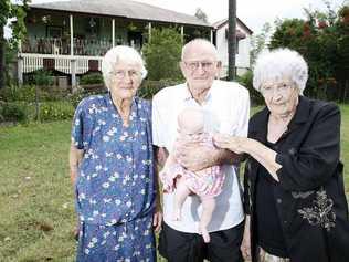 Jenny Kleve, Phillie Kleve and their brother Bob Cochrane with the youngest of the Cochrane clan, two-month-old Ebony Cochrane, outside the family home near Marburg. . Picture: Sarah Harvey